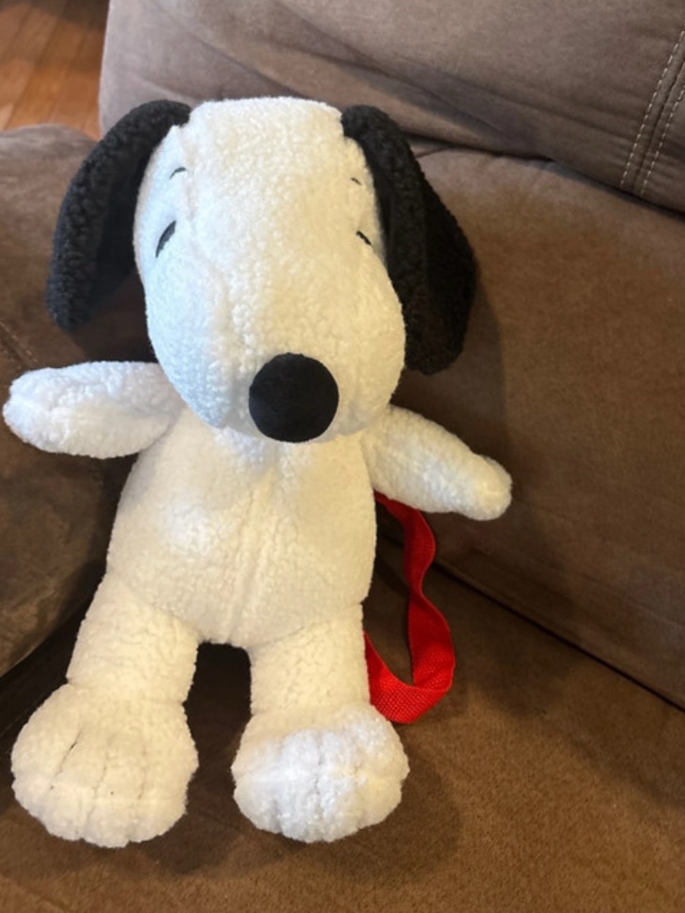 Peanuts Snoopy Sherpa Plush Backpack is a functional 2-in-1 stuffed animal